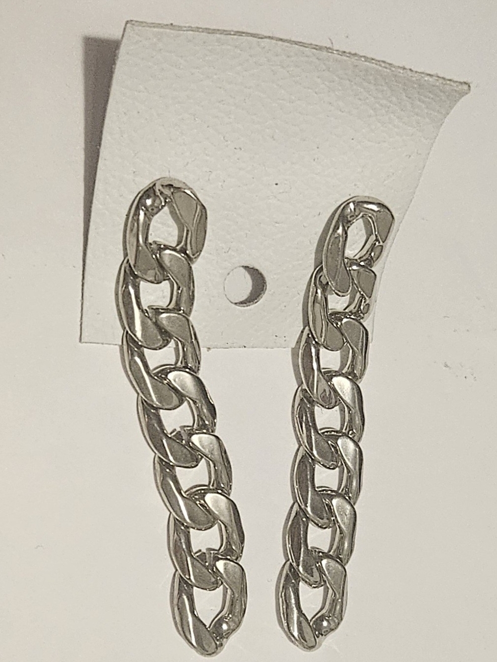 Free People Chunky, silver cuban link drop chain earrings.